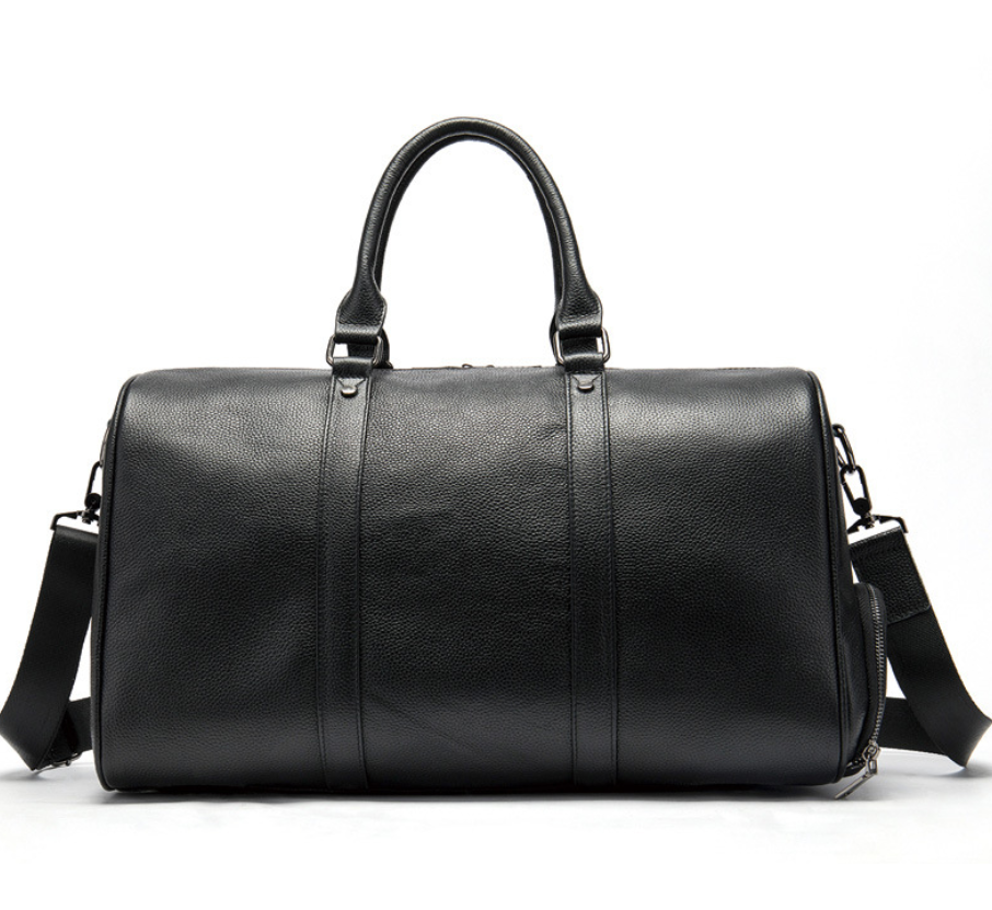 Sac de voyage homme en cuir noir élégant, avec compartiment chaussures intégré, idéal weekend.