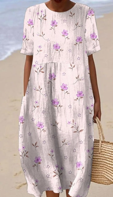 Robe femme imprimée sans manches, longueur midi. Silhouette décontractée et chic, parfaite pour la saison estivale.