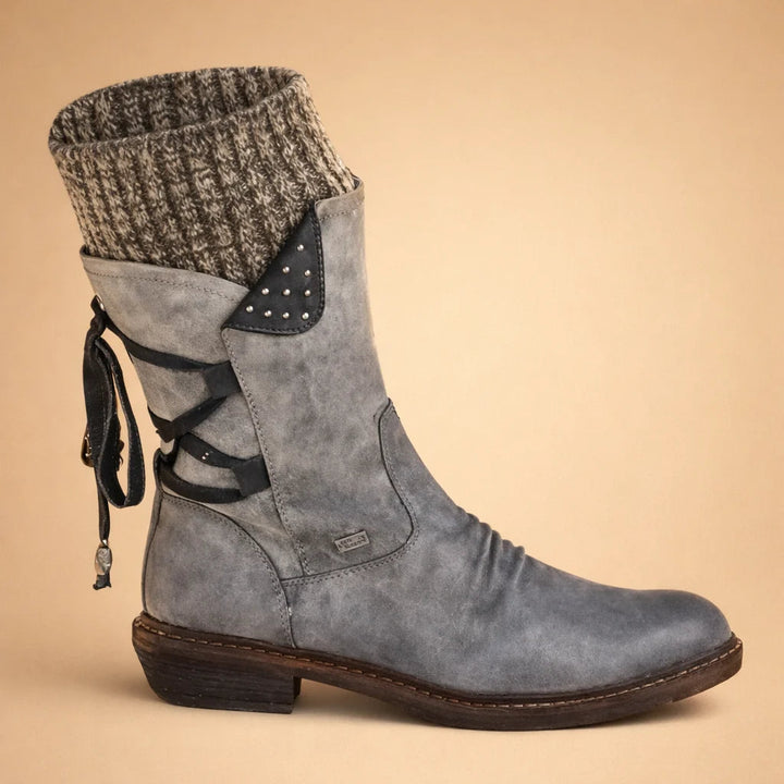 Bottines femme style martin à talon bas, parfaites pour la mode urbaine automne-hiver. Confort et polyvalence.