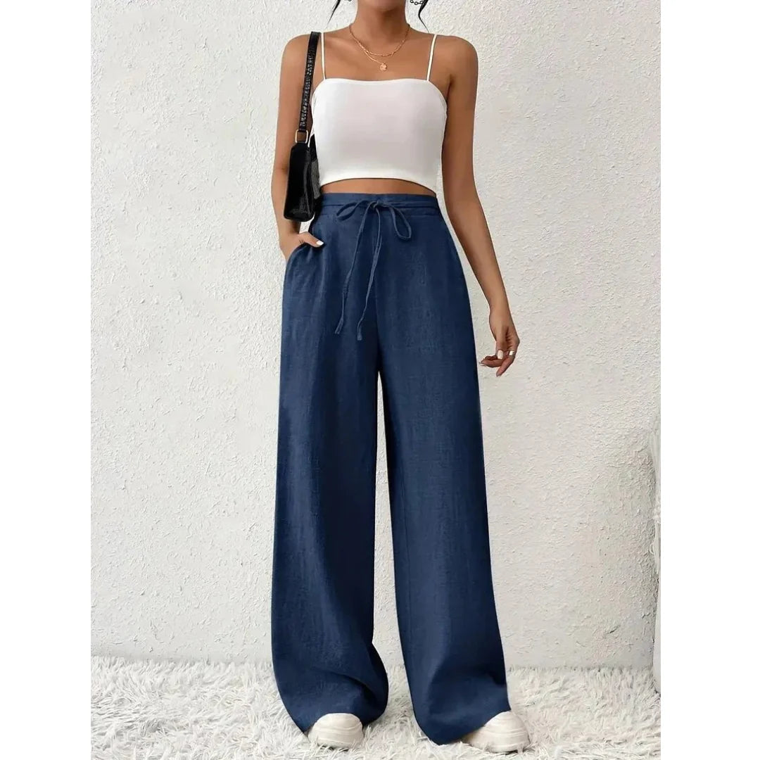 Pantalon fluide décontracté femme à taille élastique et cordon, poches latérales. Idéal pour un look quotidien chic et confortable.