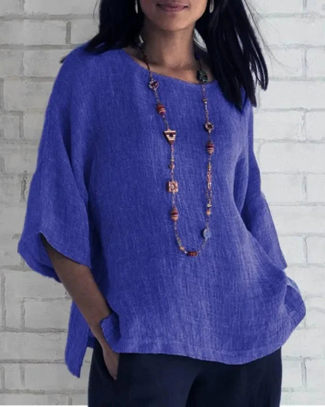 Blouse fluide femme décontractée à manches trompette. Parfaite pour un look confortable et stylé.