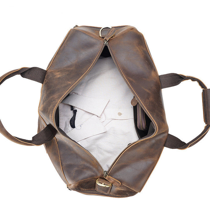 Sac cabas homme robuste style vintage en cuir marron, idéal pour le travail et les voyages.