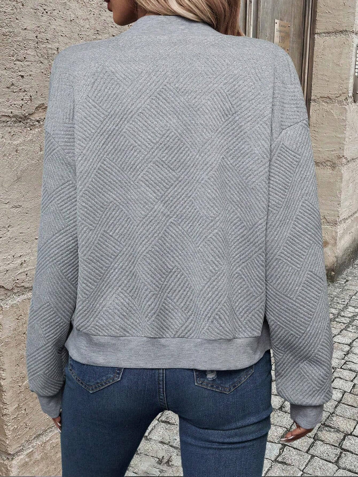 Vêtement femme: blazer décontracté zippé, col baseball, pour un style chic et contemporain.