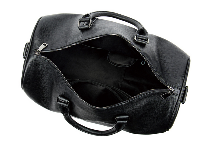 Sac cabine homme en cuir noir pour voyage ou weekend, compartiment à chaussures séparé, accessoire pratique.