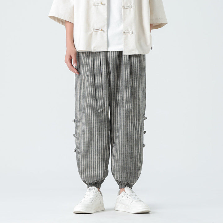 Pantalon homme ample, style chinois, avec ceinture élastiquée. Confort décontracté élégant pour l'été.