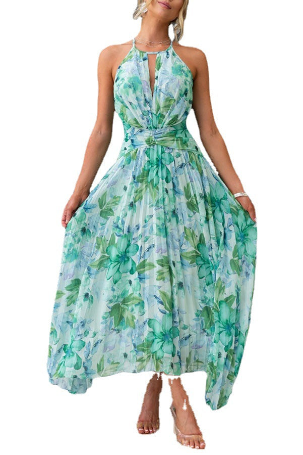 Élégante robe midi femme fluide imprimée, col halter et encolure V, sans manches. Look été décontracté chic.