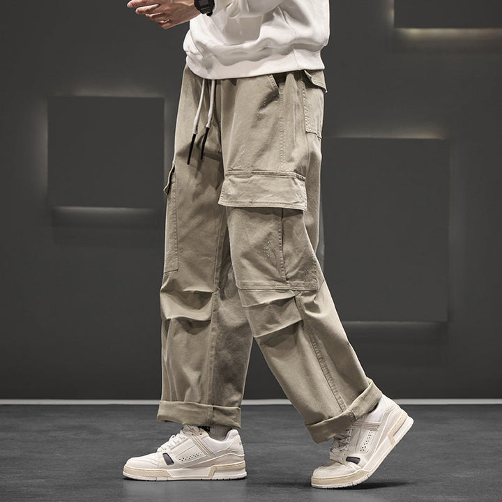 Pantalon cargo homme, taille élastique et coupe large ultra confortable. Vêtement décontracté, mode masculine moderne.