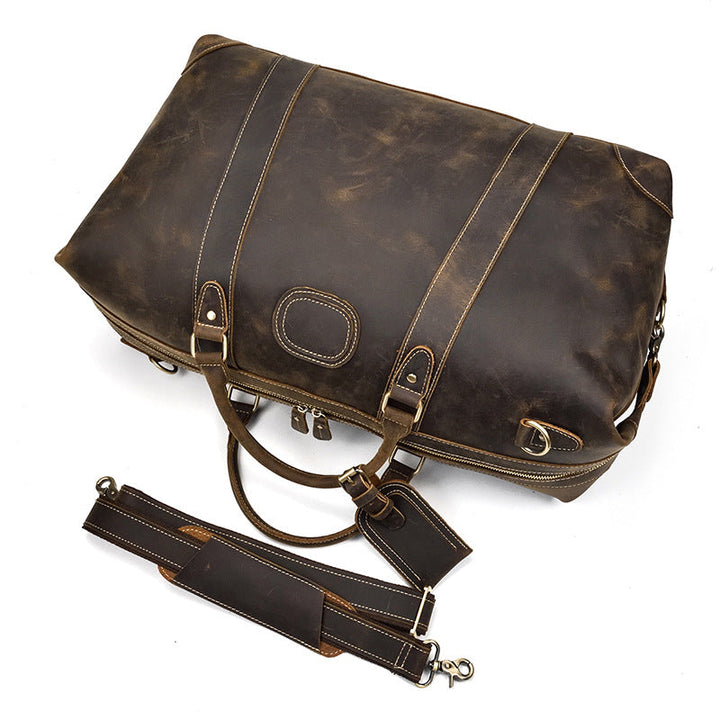 Sac de voyage homme grande capacité, duffel en cuir marron vintage, idéal pour les longs séjours.