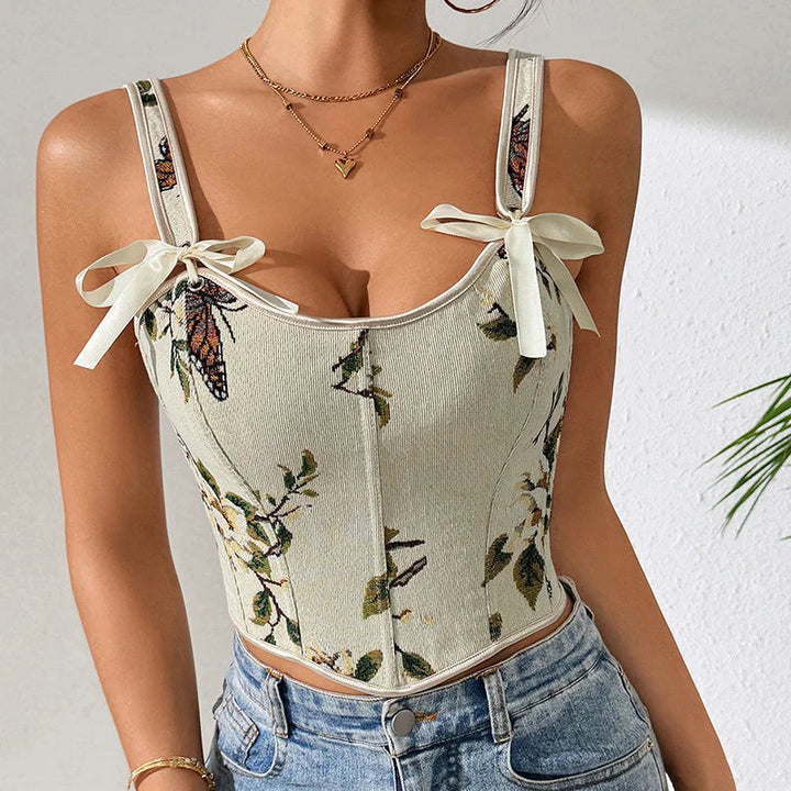 Gilet cintrée femme fleuri, bretelles à nouer. Ce haut chic est idéal pour une allure élégante au printemps.