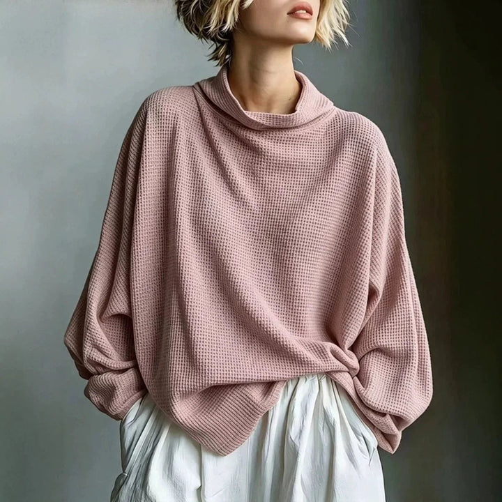 Pull femme chaud en maille nid d'abeille, col roulé. Parfait pour rester confortable et stylée en automne/hiver.