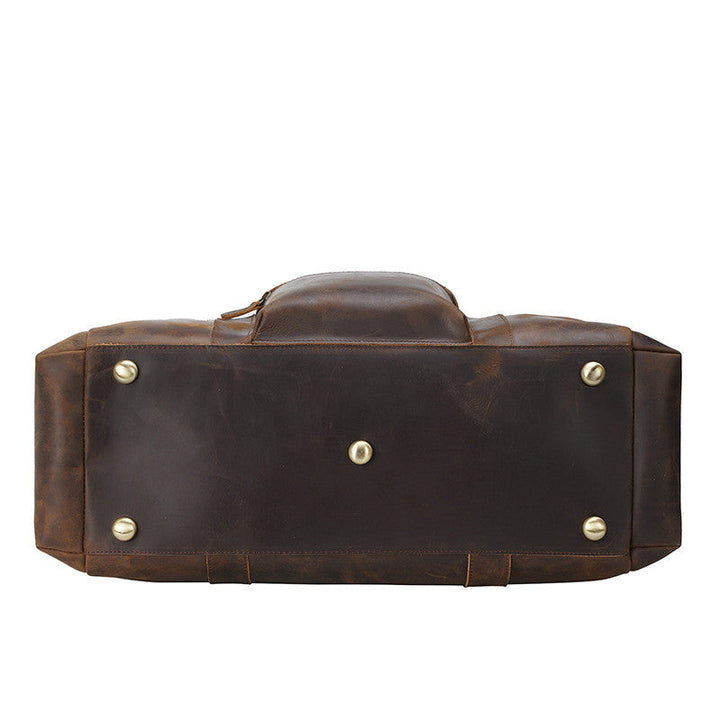 Sac cabas homme vintage marron, un accessoire en cuir de grande capacité pour le travail ou loisirs.