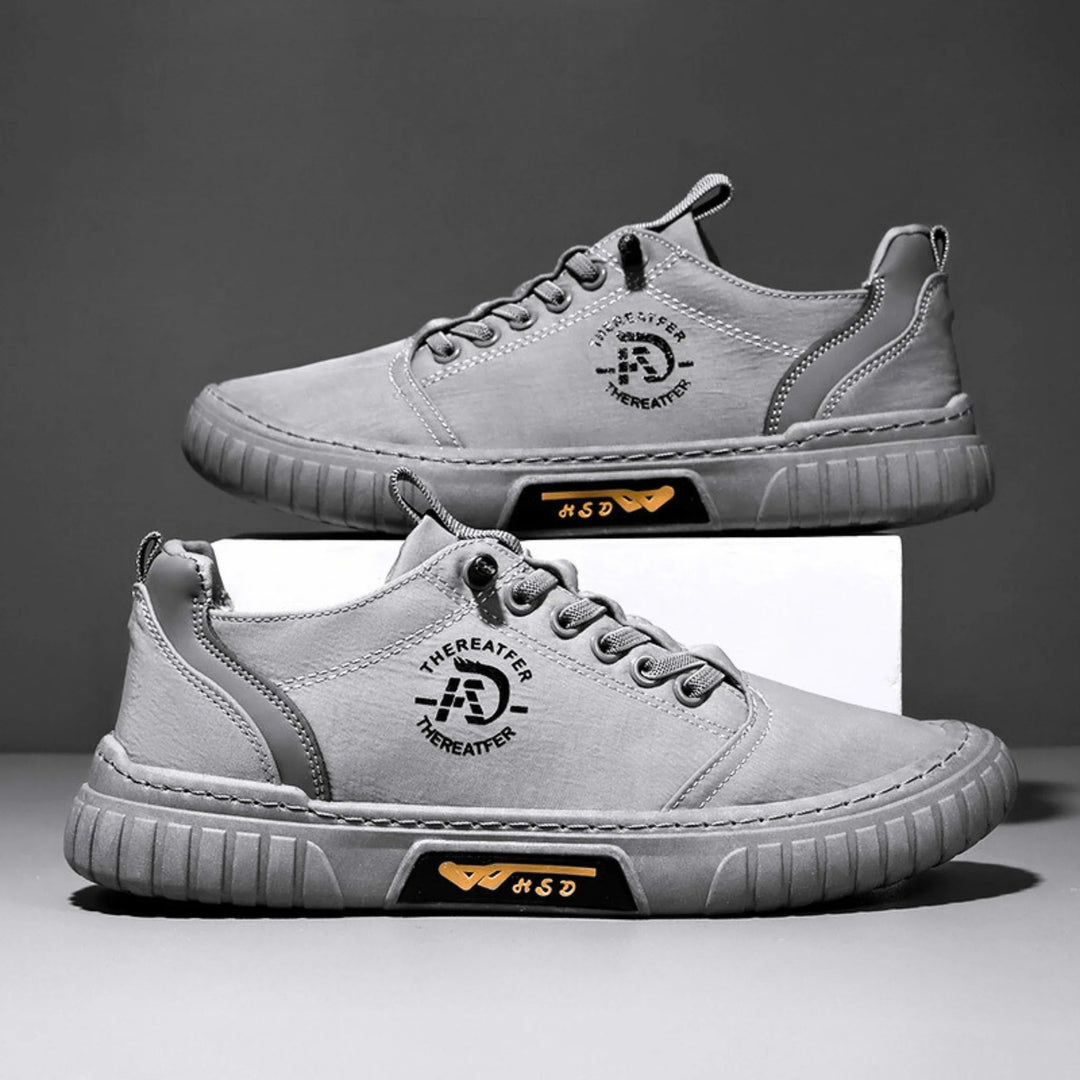 Sneaker homme au style urbain décontracté, grise, noire ou verte. Confort optimal et matière respirante légère.