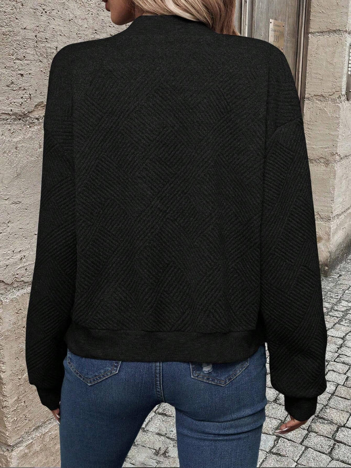Élégant blazer femme à col baseball et fermeture éclair, parfait pour un style chic décontracté.