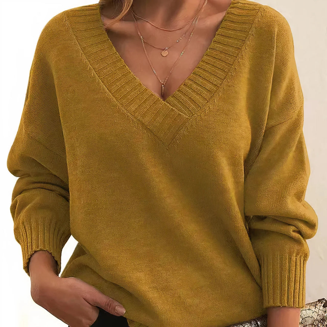 Pull femme en tricot doux et chaud, coupe confortable et style décontracté pour toutes saisons.