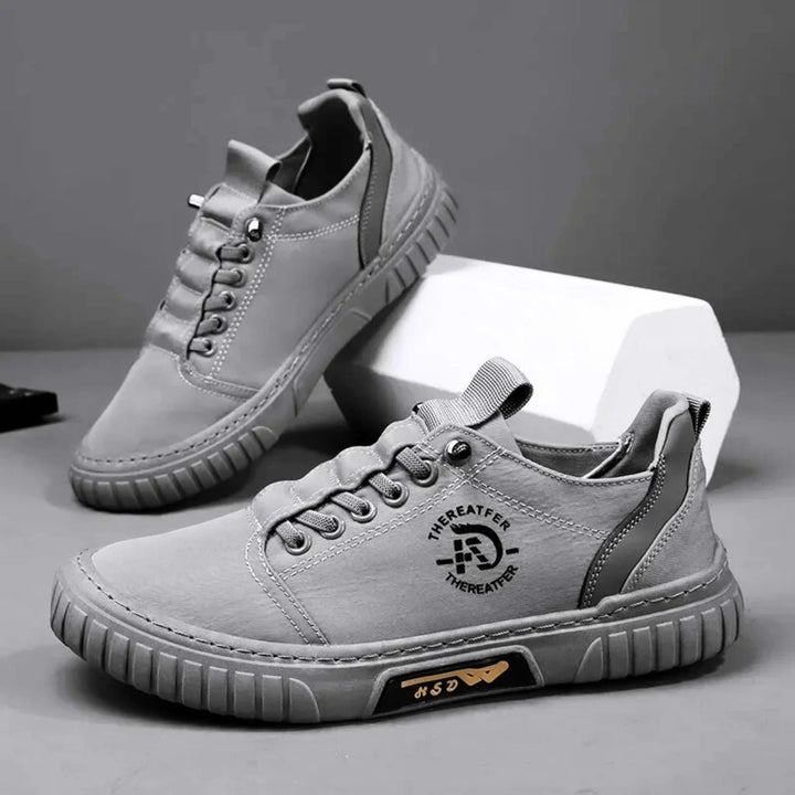 Chaussures sneaker homme grises, respirantes et légères. Idéales pour un look urbain décontracté et confortable.