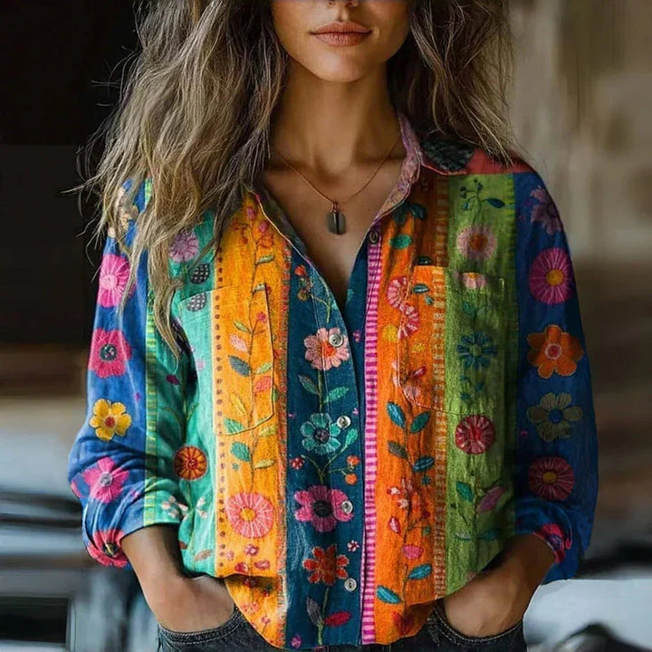 Blouse femme ample à manches longues, motif 3D texturé, offrant un style chic, moderne et très confortable.