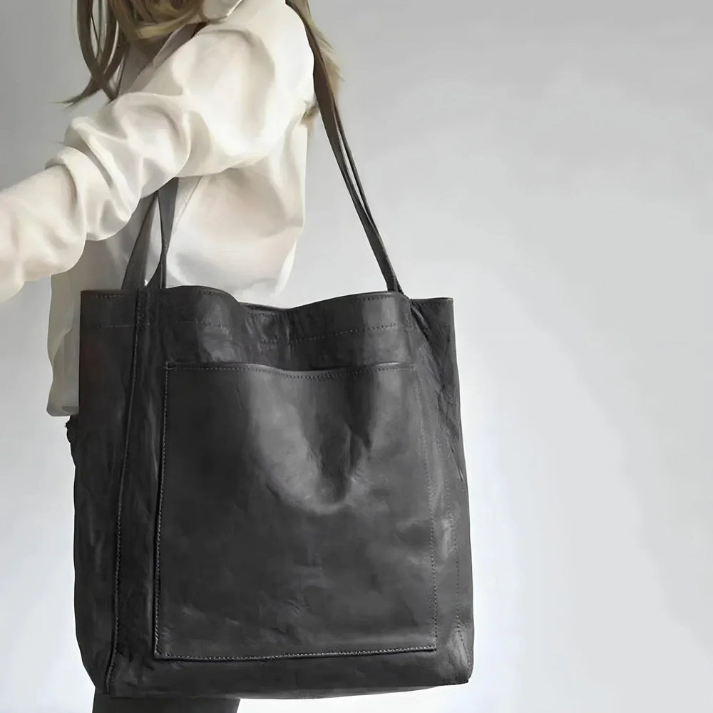 Sac shopper en cuir brun foncé, élégant et pratique, parfait pour les femmes actives au quotidien.