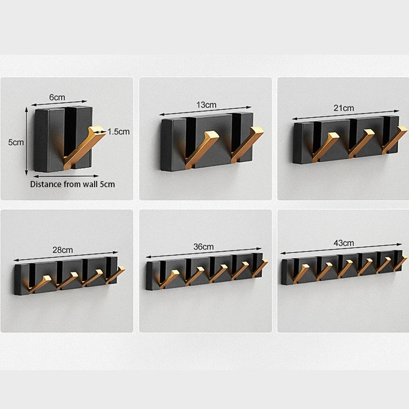 Crochet mural discret, 5 patères escamotables en inox. Idéal pour l'organisation de votre entrée ou salle de bain moderne.