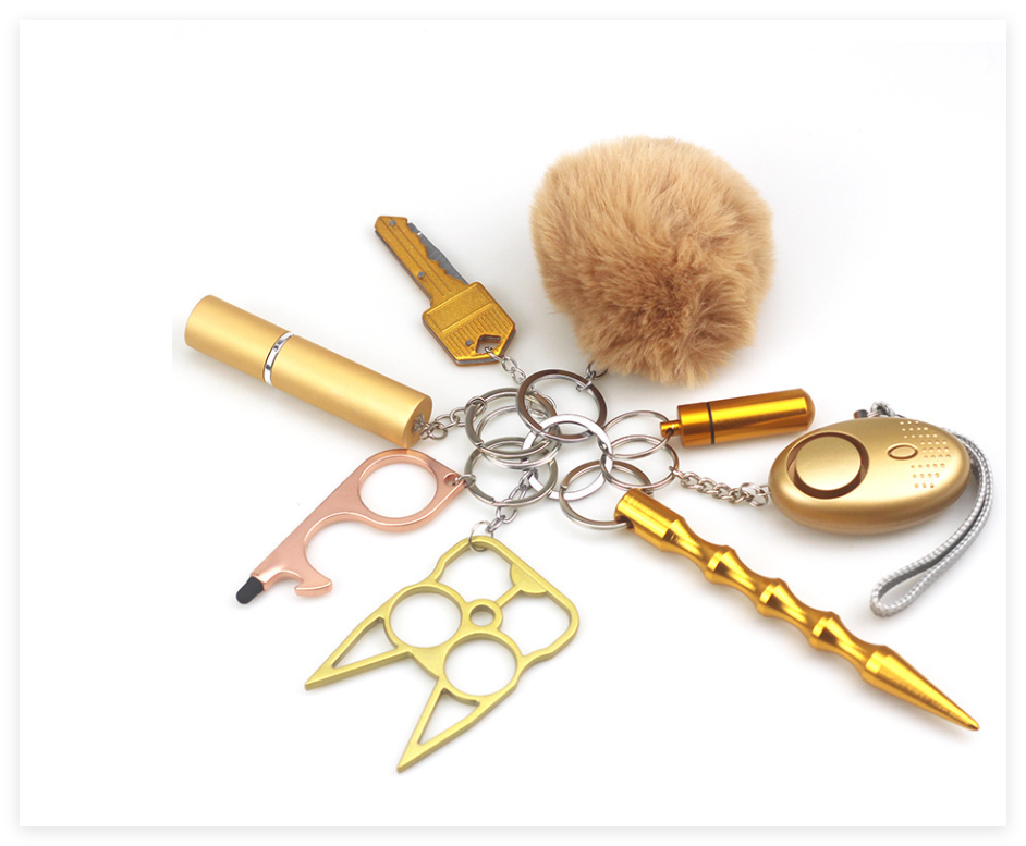 Kit complet de défense personnelle pour femme, incluant alarme, sifflet et porte-clés sécurité. Protection individuelle.