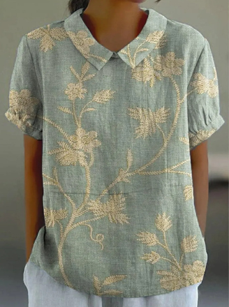 Blouse femme élégante verte à imprimé floral léger, idéale pour l'été et le printemps, style chic décontracté.