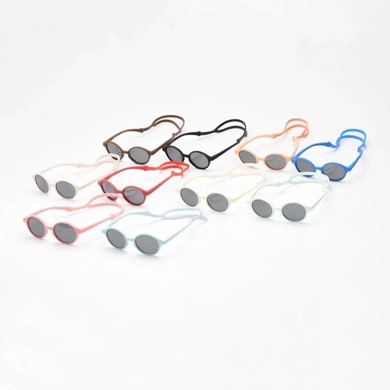 Lunettes de soleil bébé flexibles et durables, protection UV400 optimale, sangle de maintien.