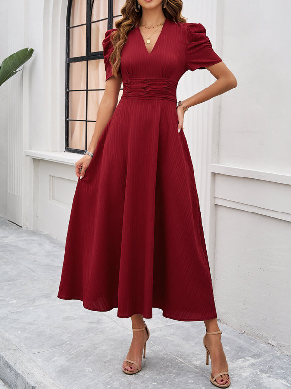 Robe chic col V pour femme, manches bouffantes. Une robe midi élégante, parfaite pour vos soirées ou fêtes.