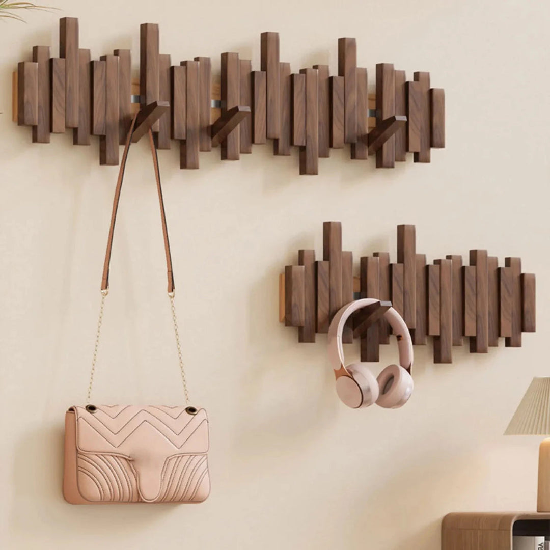 Porte-manteau mural design piano avec patères rétractables en bois. Rangement élégant pour l'entrée.