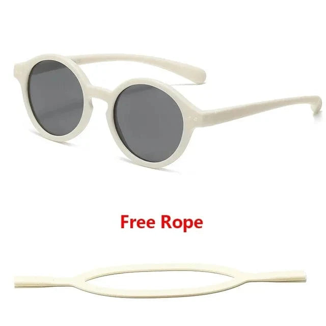 Protection oculaire bébé: lunettes de soleil souples UV400, bandeau réglable, idéales pour la plage.
