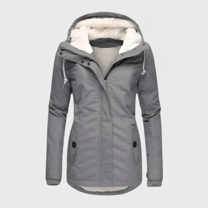 Veste femme à capuche imperméable et élégante. Confortable pour l'automne/hiver, coupe-vent, style casual ou extérieur.