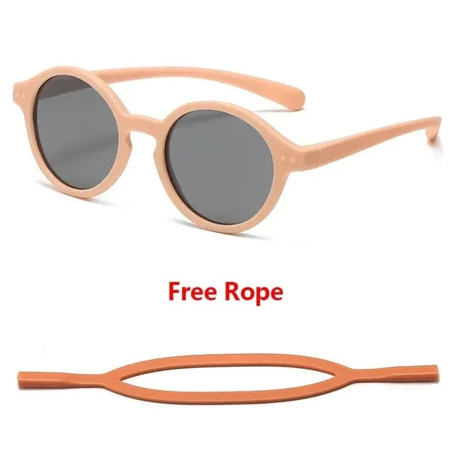 Lunettes enfant flexibles, protection UV400, sangle ajustable pour éviter les pertes, style et sécurité.