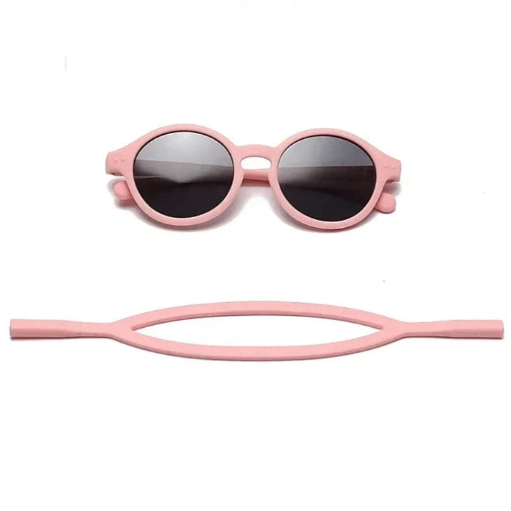 Lunettes soleil bébé flexibles, protection UV400, sangle réglable, idéales pour yeux sensibles.