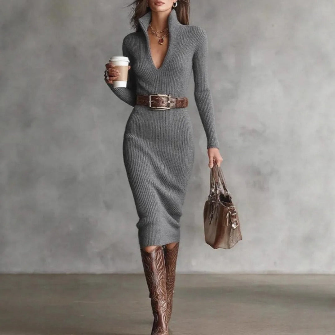Silhouette élancée avec cette robe midi femme ajustée et ceinturée à manches longues.