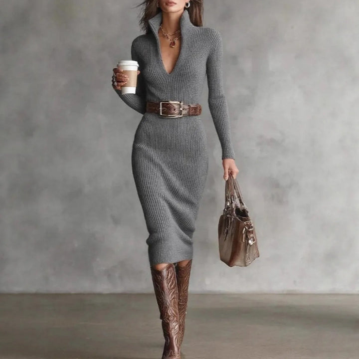 Silhouette élancée avec cette robe midi femme ajustée et ceinturée à manches longues.