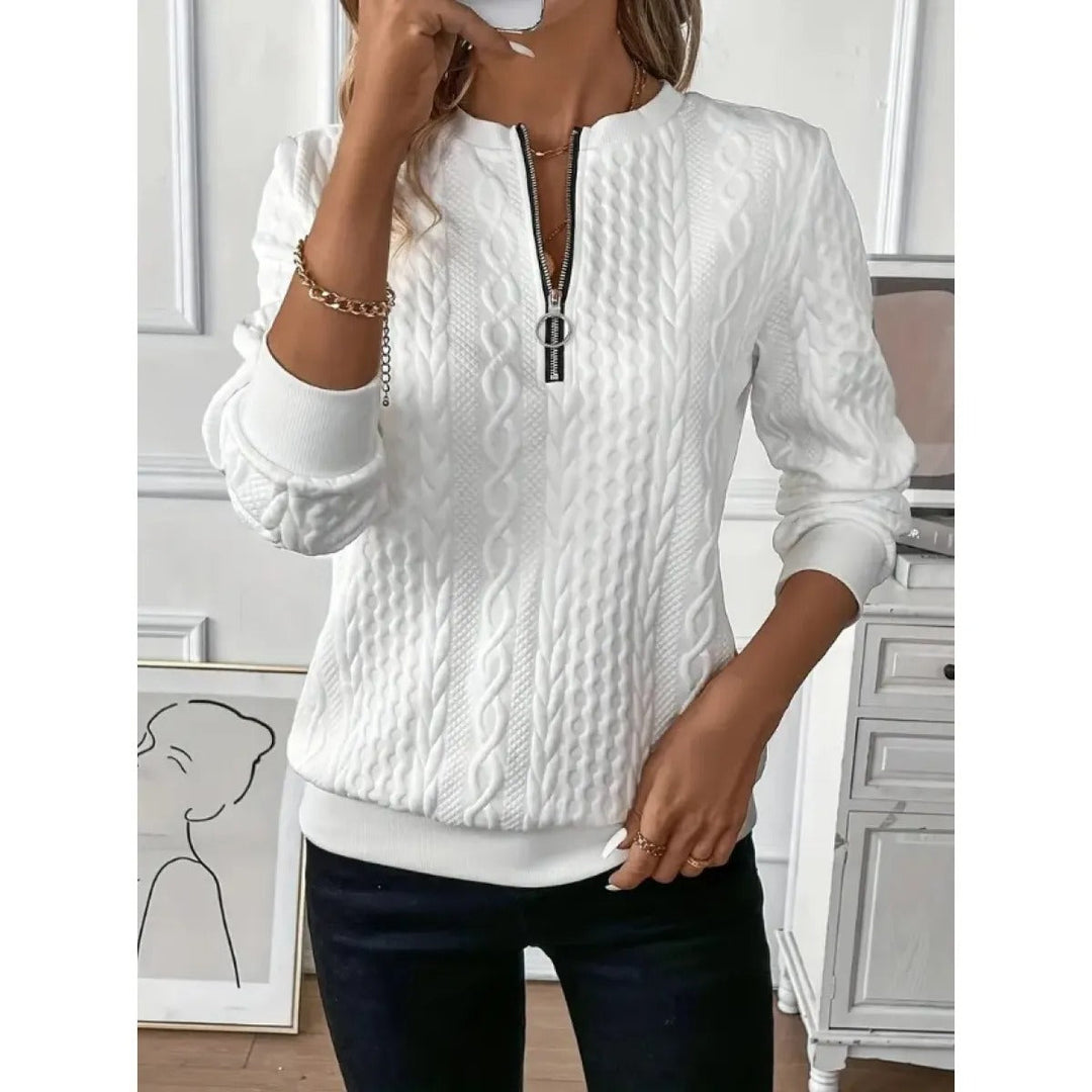 Pull femme chic & confortable. Maille texturée, col zippé élégant. Un vêtement idéal pour un look décontracté ou sophistiqué.