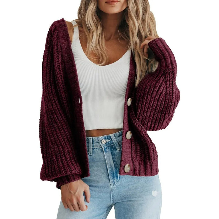 Cardigan pull femme tendance, coupe oversize, manches ballon élégantes et matière confortable.