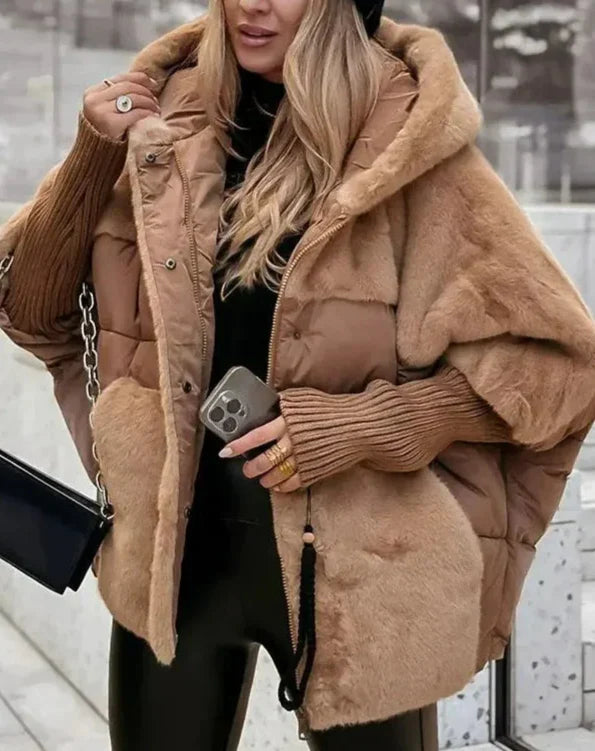 Doudoune oversize femme chaude, avec capuche en fausse fourrure élégante pour un style hivernal chic.