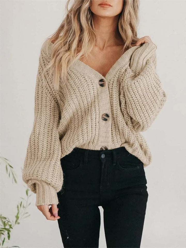 Cardigan femme chic oversize à manches ballon, idéal pour un look automnal élégant et confortable.