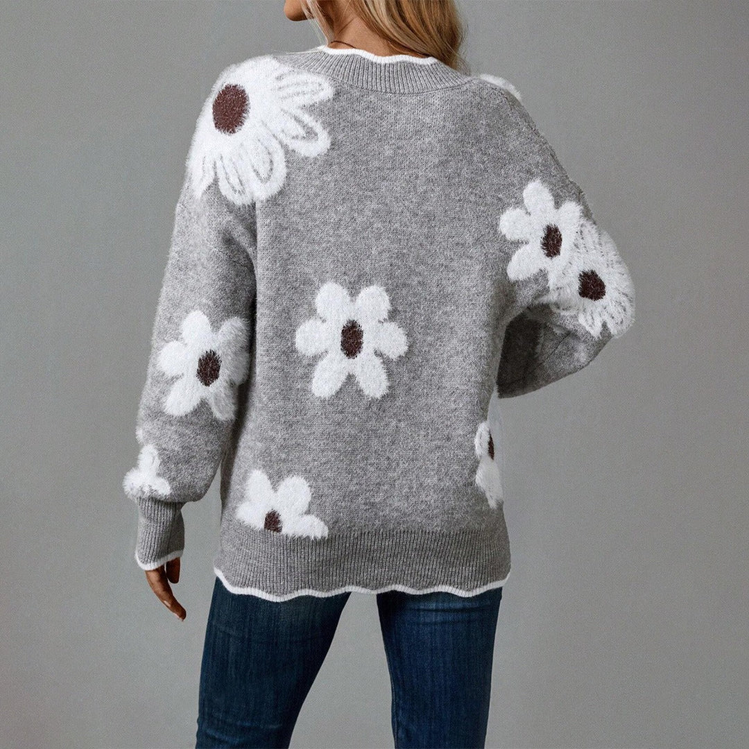 Pull femme confortable à manches longues avec un motif fleuri texturé distinctif. Idéal pour l'hiver chic.