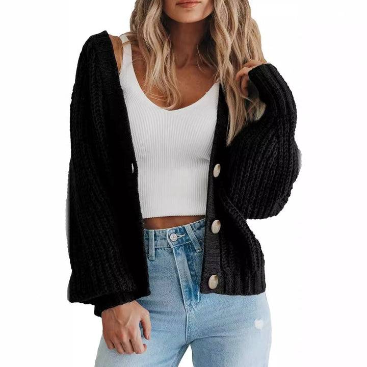 Élégant cardigan femme à manches ballon, coupe ample et confortable. Idéal pour un look hivernal raffiné.
