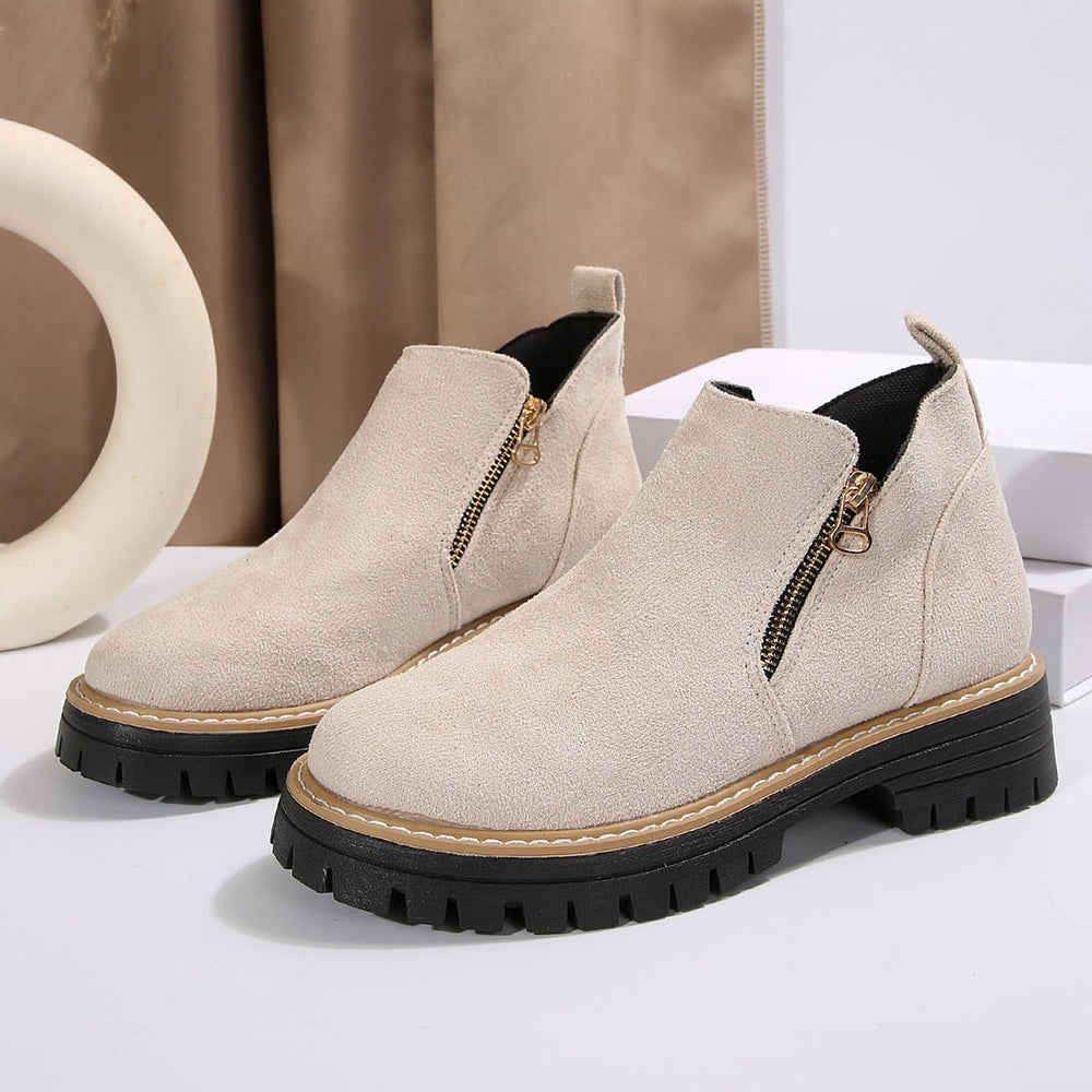 Bottines femme tendance automne-hiver avec semelle épaisse et design moderne. Confortable et élégant.