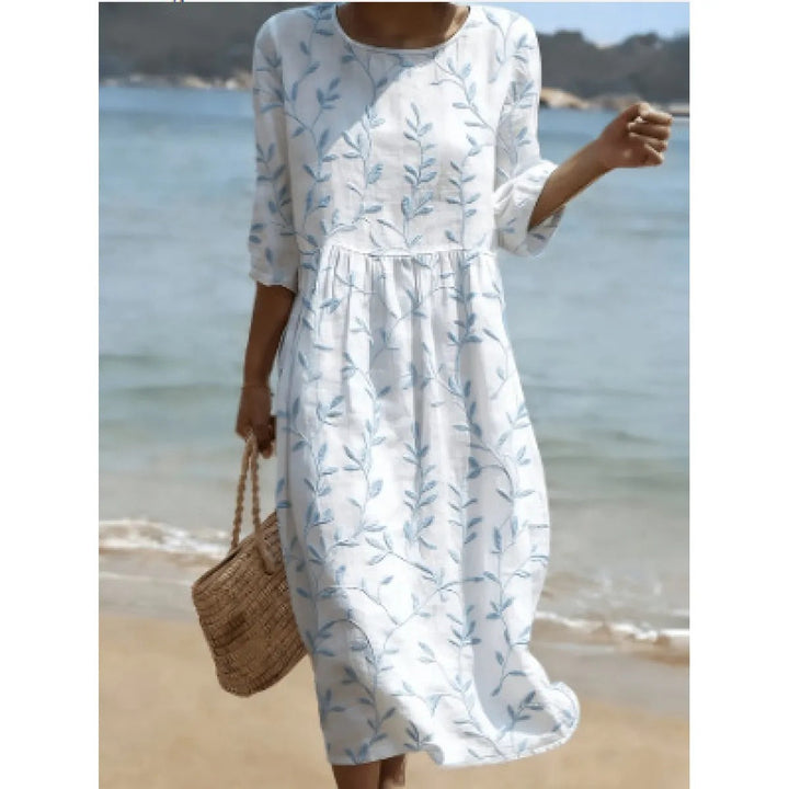 Robe midi fleurie femme, tissu léger et élégant. Imprimé botanique pour un look printanier décontracté et chic.