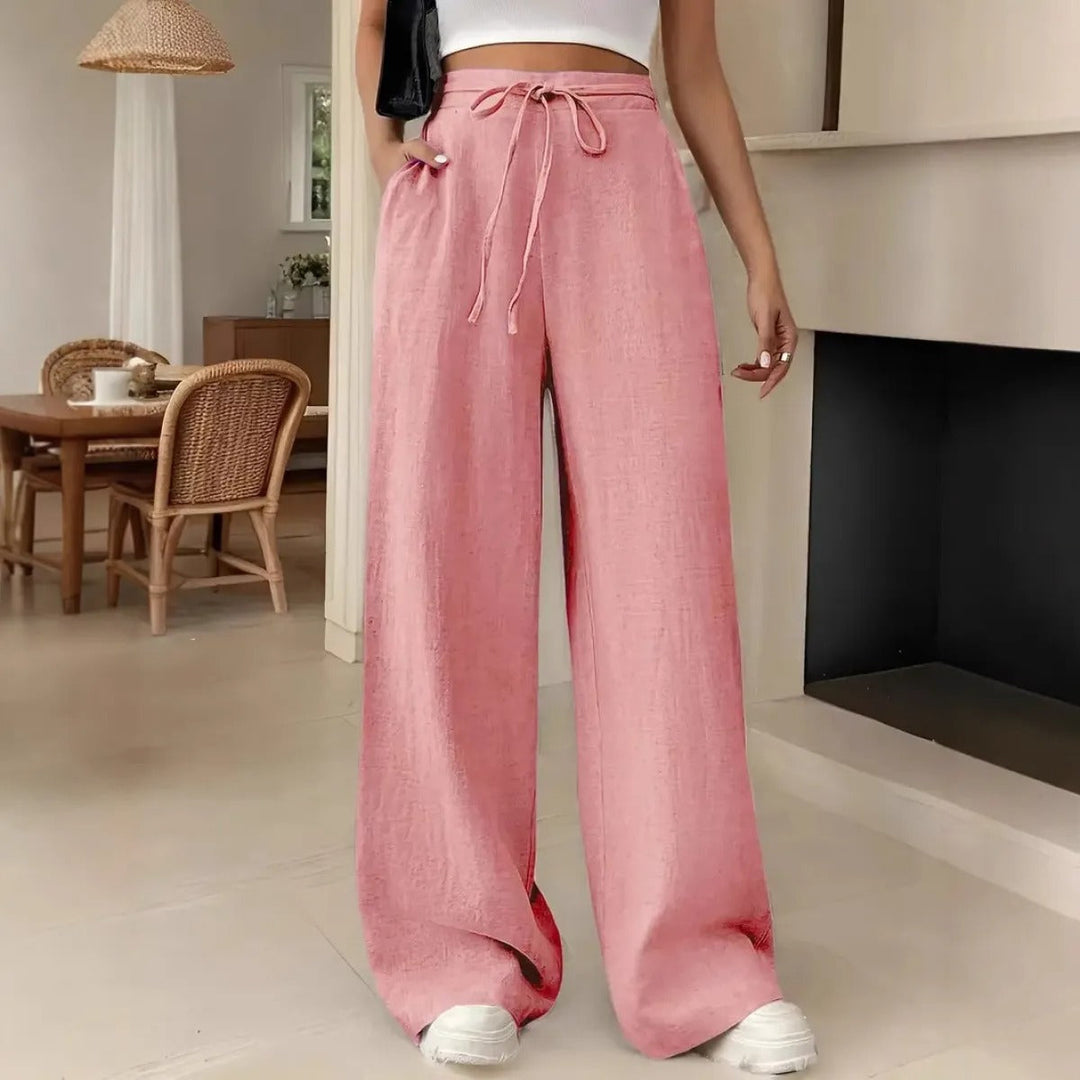 Pantalon femme large et décontracté, taille ajustable par cordon, poches fonctionnelles. Idéal pour un style quotidien polyvalent.