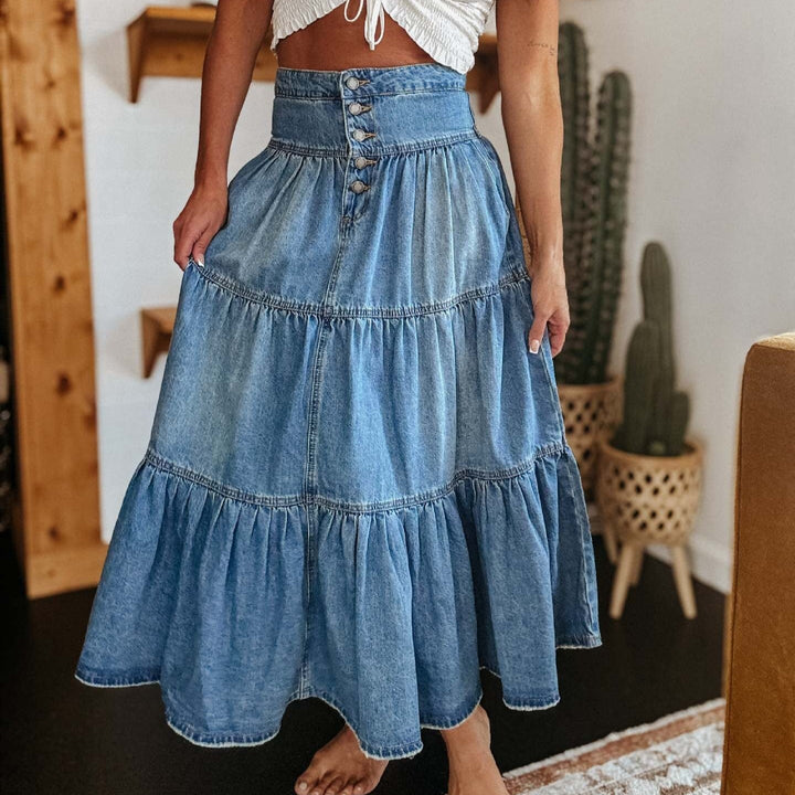 Jupe midi en denim pour femme, taille haute, avec volants élégants. Parfaite pour l'été, look décontracté et mode.