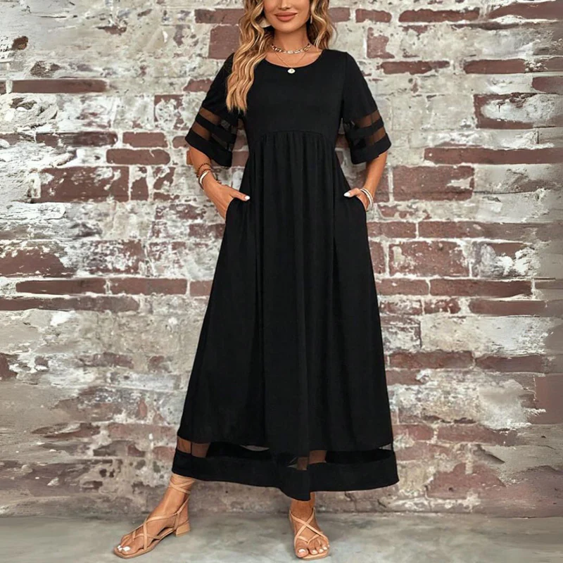 Robe midi femme chic, fluide, avec poches discrètes, manches 3/4 et empiècements transparents pour l'été.