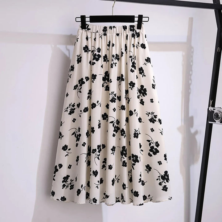 Jupe midi florale fluide pour femme, idéale printemps/été. Imprimé élégant, taille élastique, style décontracté tendance.