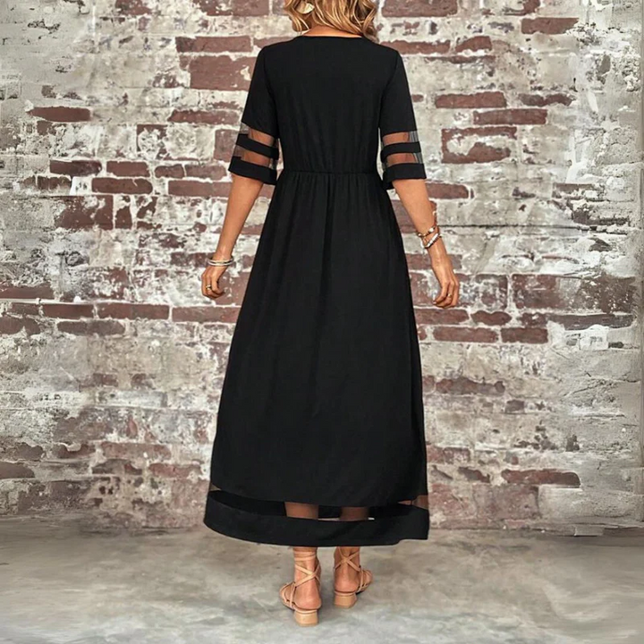Robe longue femme fluide et légère, transparence subtile, idéale pour une mode féminine moderne et confortable.