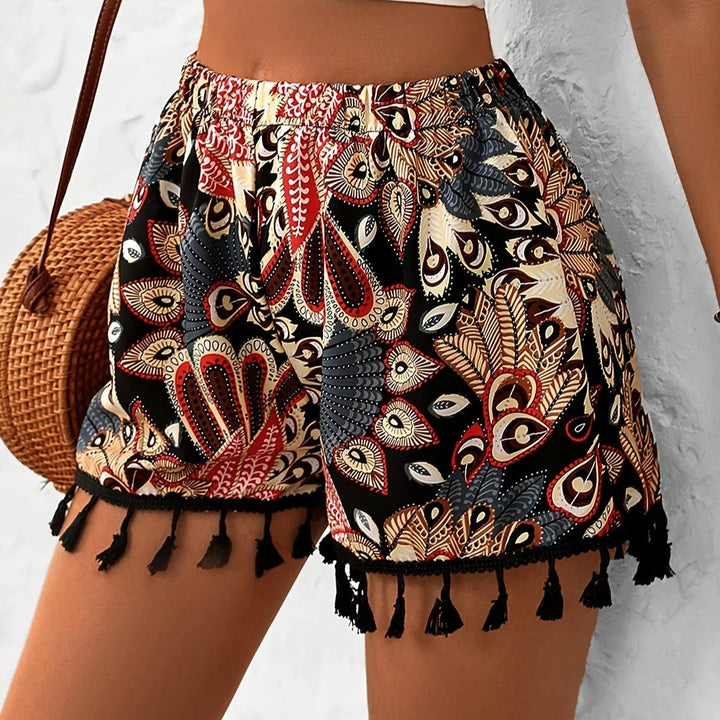 Short femme taille haute imprimé bohème, chic et décontracté avec pompons. Parfait pour la mode été et les vacances.