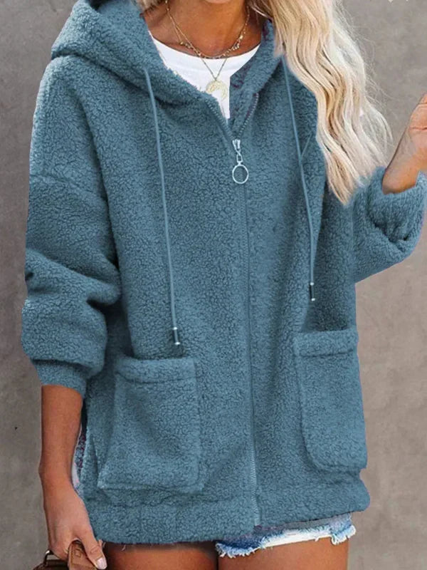 Veste femme oversize à capuche noire avec fermeture éclair et poches, style décontracté pour automne/hiver.