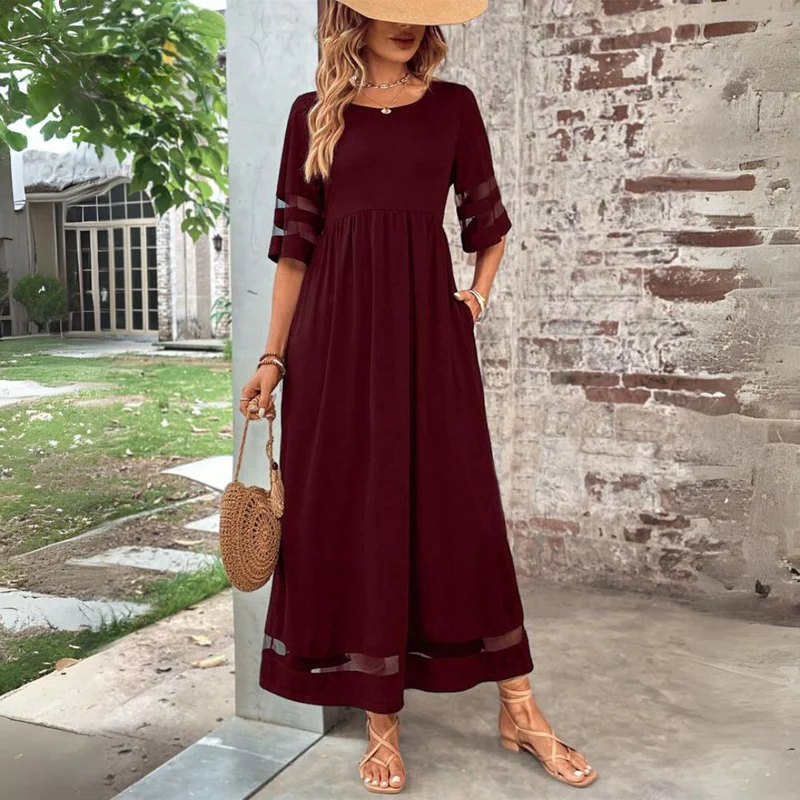 Robe midi fluide femme, à manches 3/4, élégante et versatile, avec poches, pour un look été chic et décontracté.