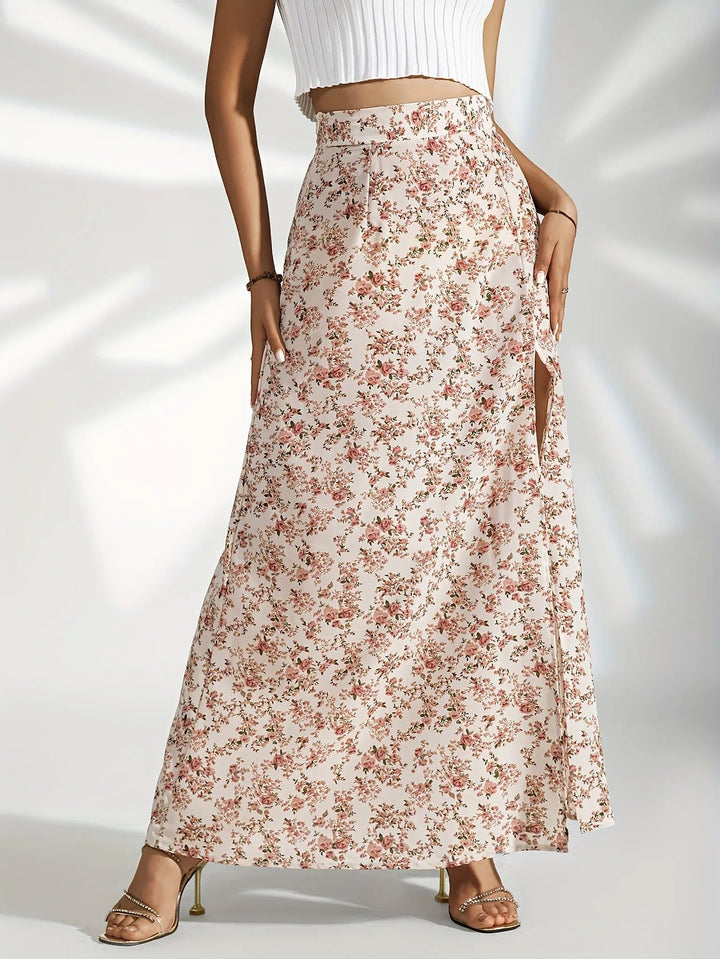 Jupe longue fluide pour femme avec imprimé floral d'été. Taille haute et fente latérale pour confort et élégance.